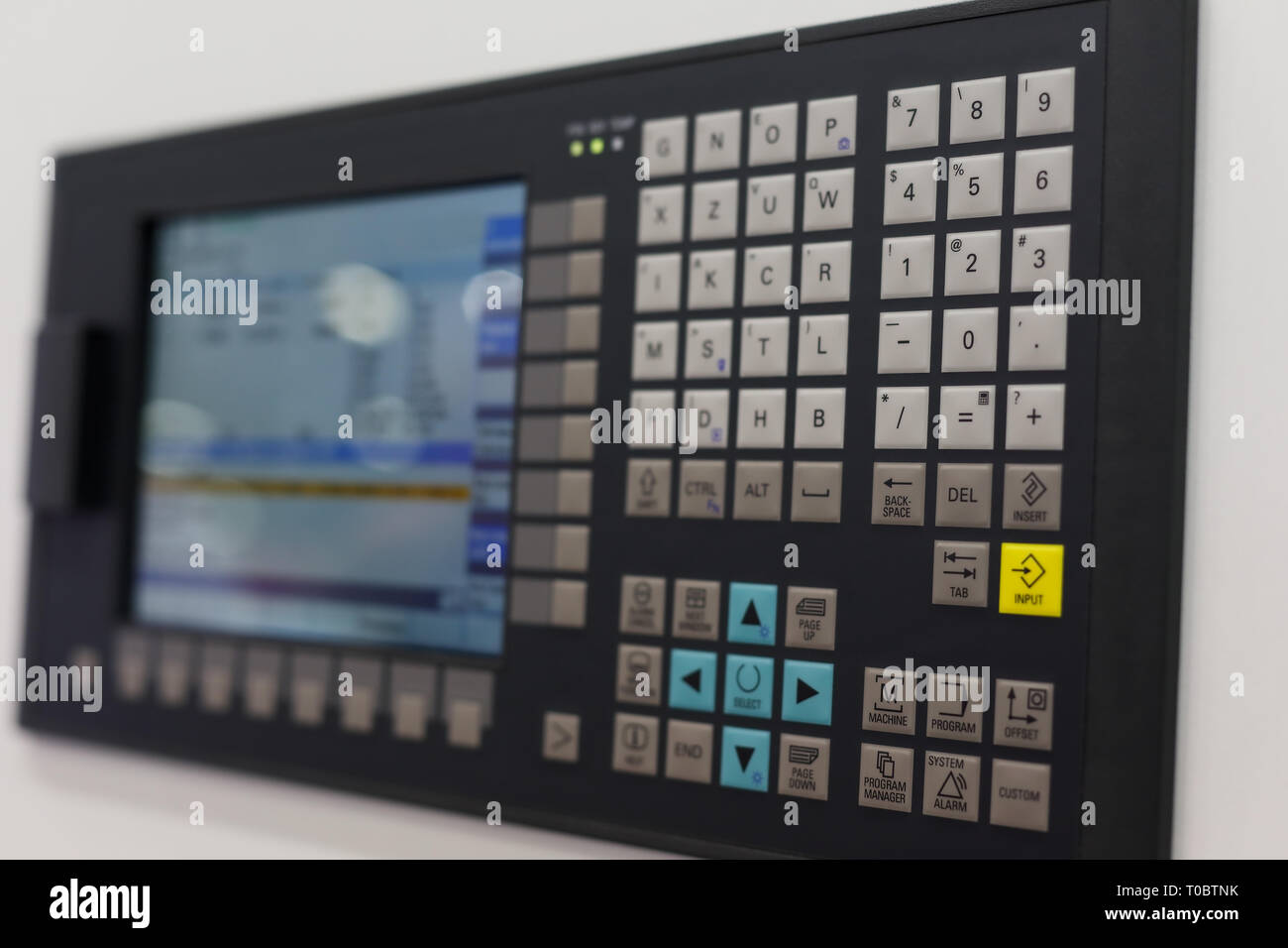 Control panel and screen of CNC-operated machine. Selective focus Stock ...