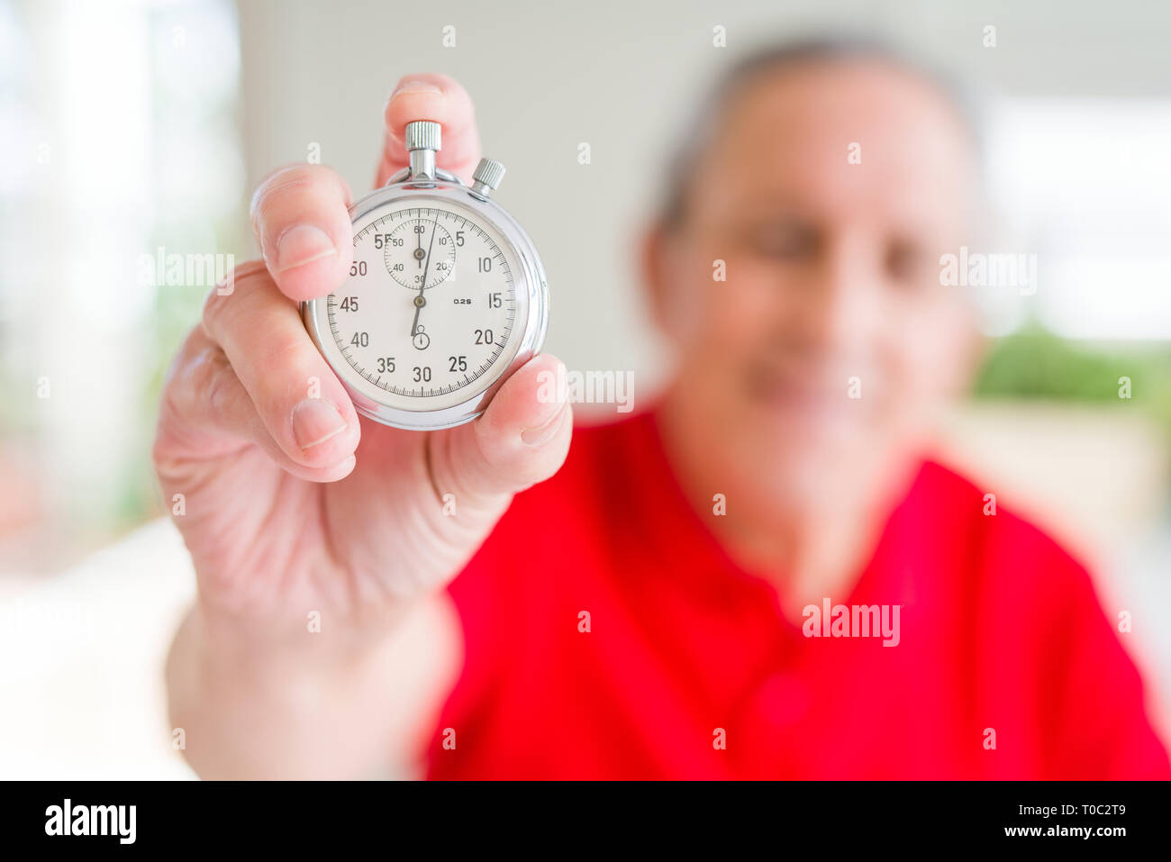 Handsome Senior Man Holding Stopwach Showing Countdown With A Happy Face Standing And Smiling 