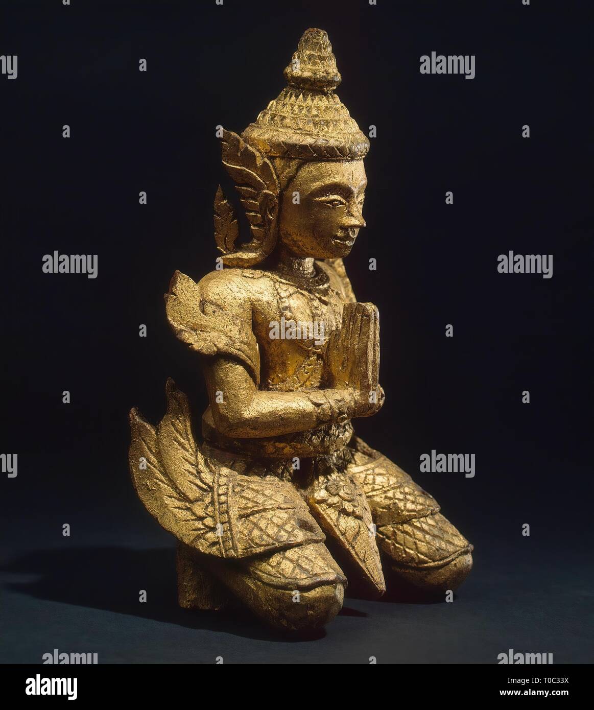 'Kneeling Adorer'. Siam (now Thailand). Bangkok art, Late 18th - early of the 19th century. Dimensions: h. 20 cm. Museum: State Hermitage, St. Petersburg. Stock Photo