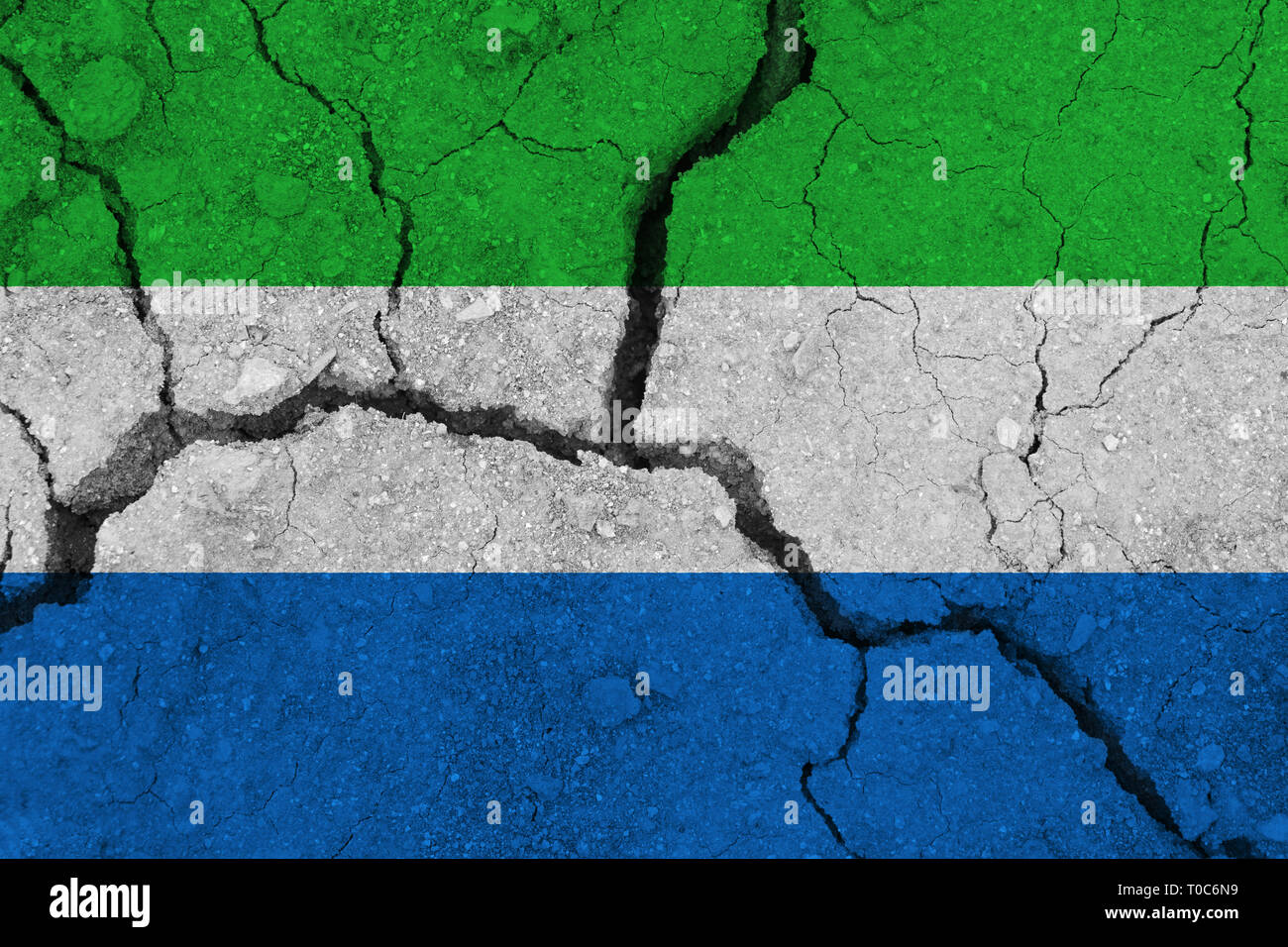 Sierra leone flag on the cracked earth. National flag of Sierra leone ...