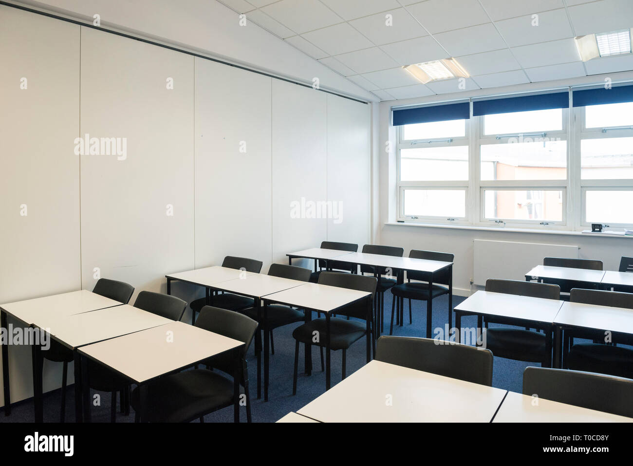Empty classrooms at a school / college / university with desks, tables