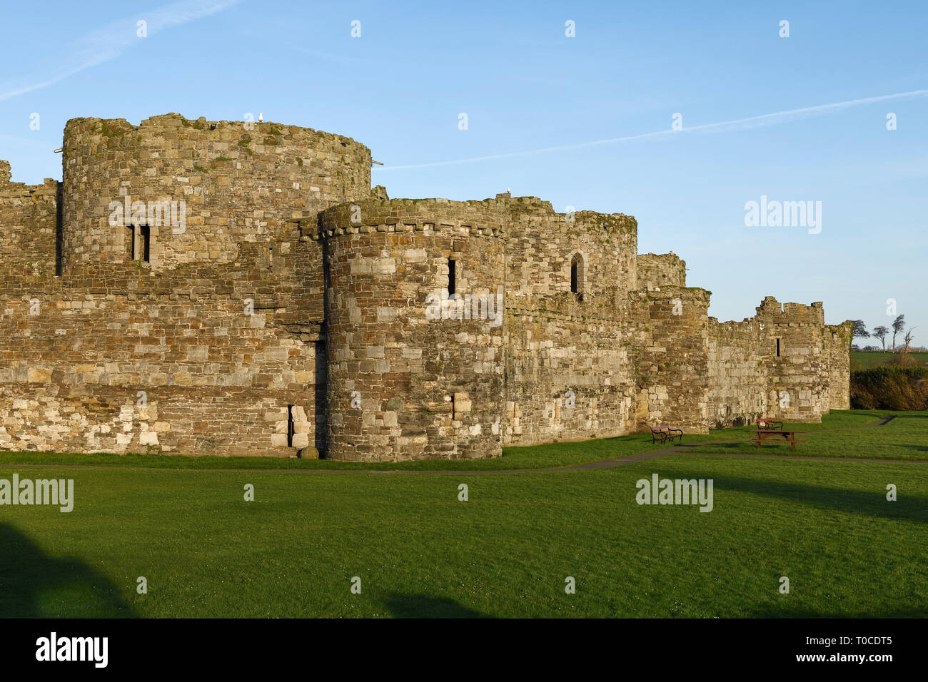 The outer wall of Beaumaris Castle in the town of Beaumaris on Anglesey ...