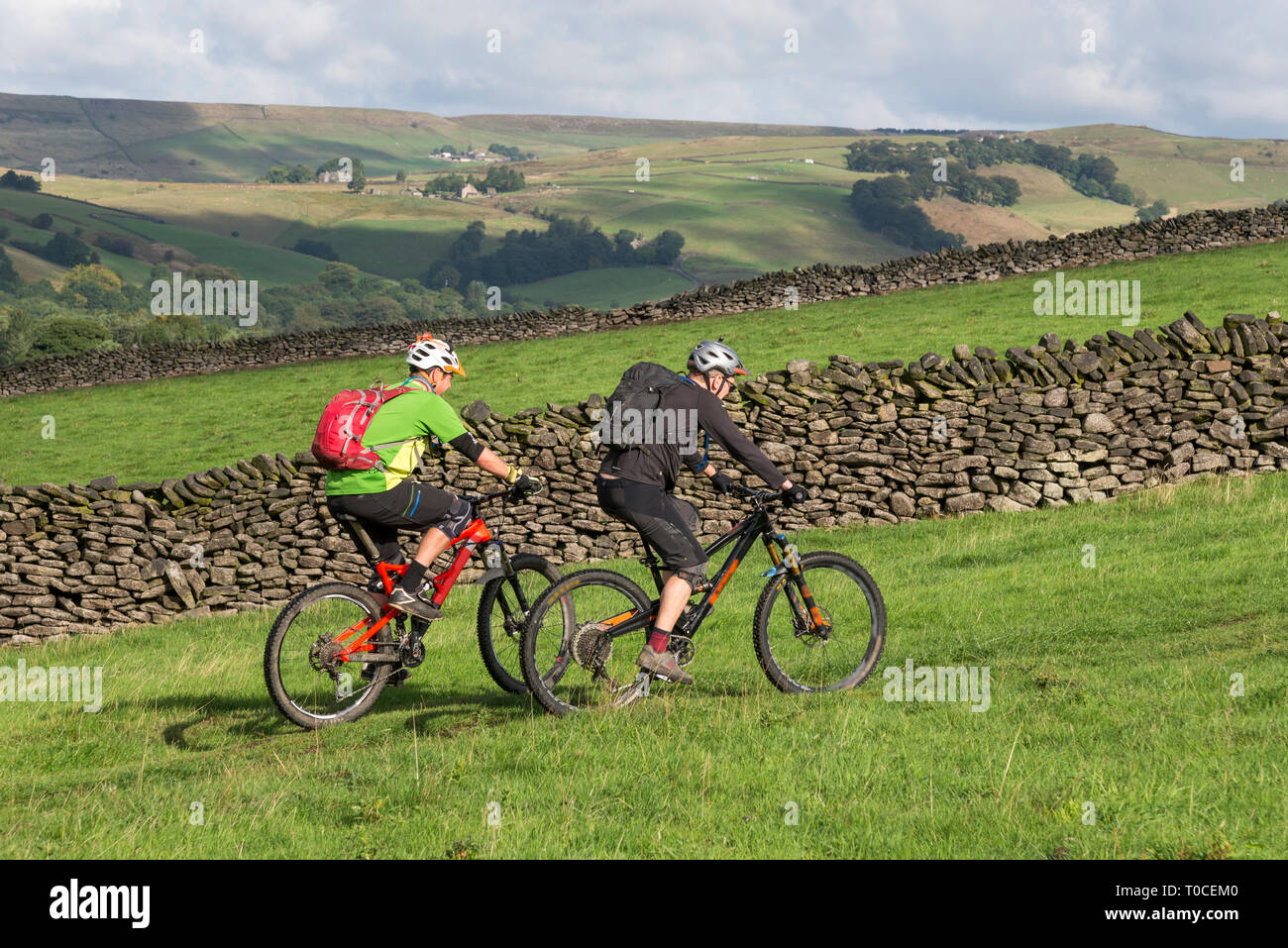 Two male cyclists in the hills near Hayfield in the Peak District on a fine summer day. Stock Photo