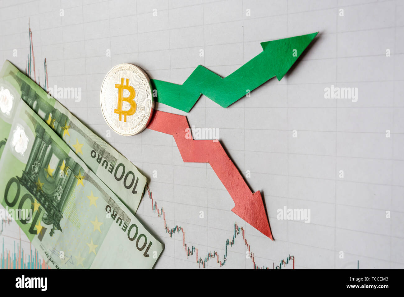 fluctuations  and forecasting of exchange rates of virtual money. Red and green arrows with golden Bitcoin ladder on gray paper forex chart background Stock Photo