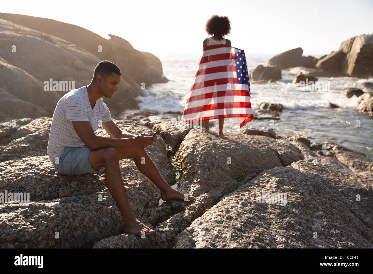 Couple relaxing on beach Stock Photo
