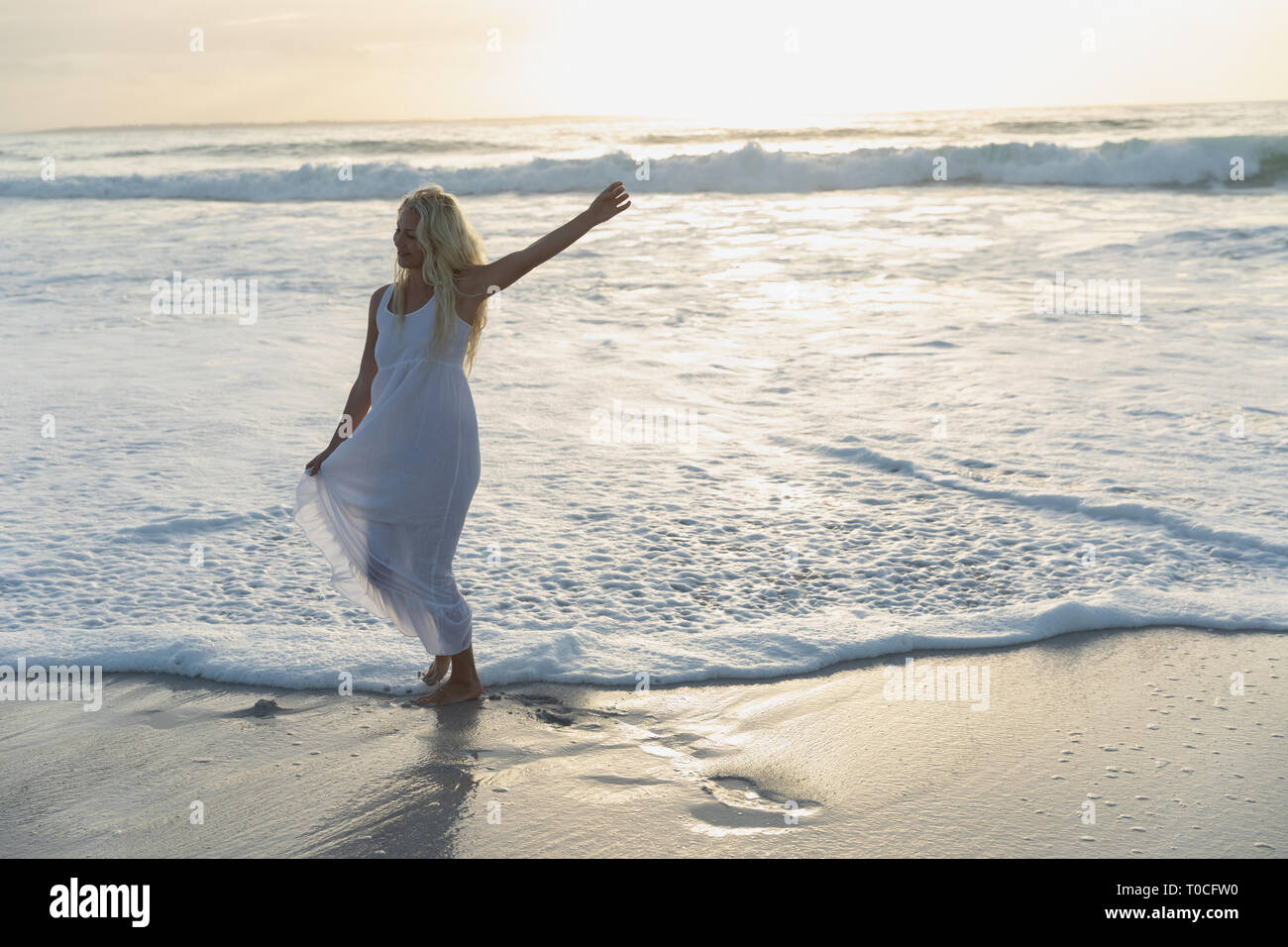 Young woman posing beach hi-res stock photography and images - Alamy