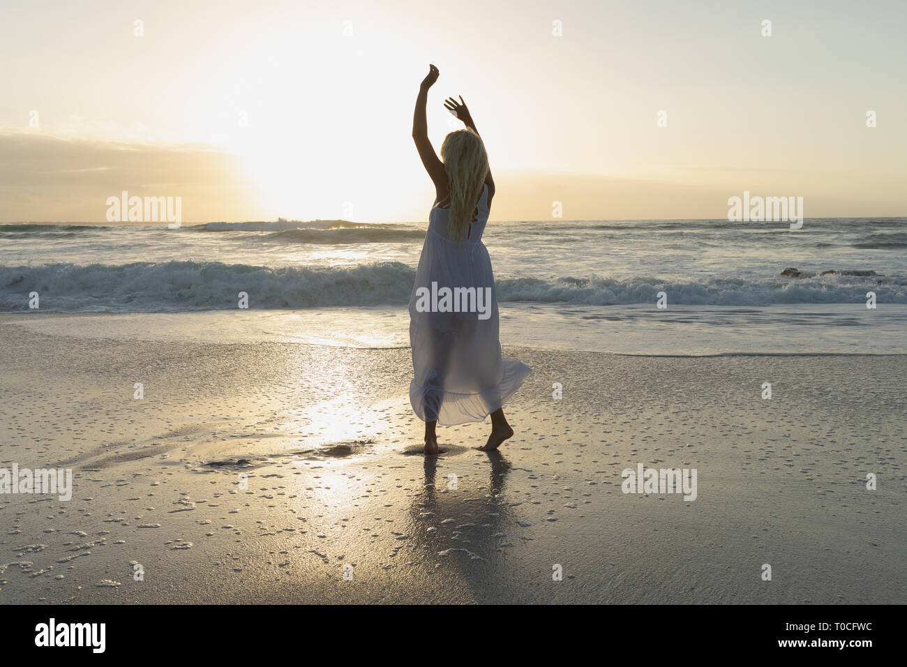 Woman young posing at on the beach hi-res stock photography and images ...