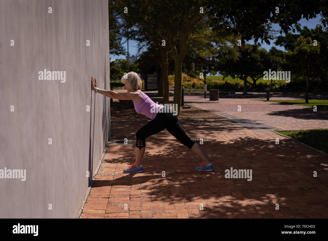 Active senior woman exercising in the park Stock Photo