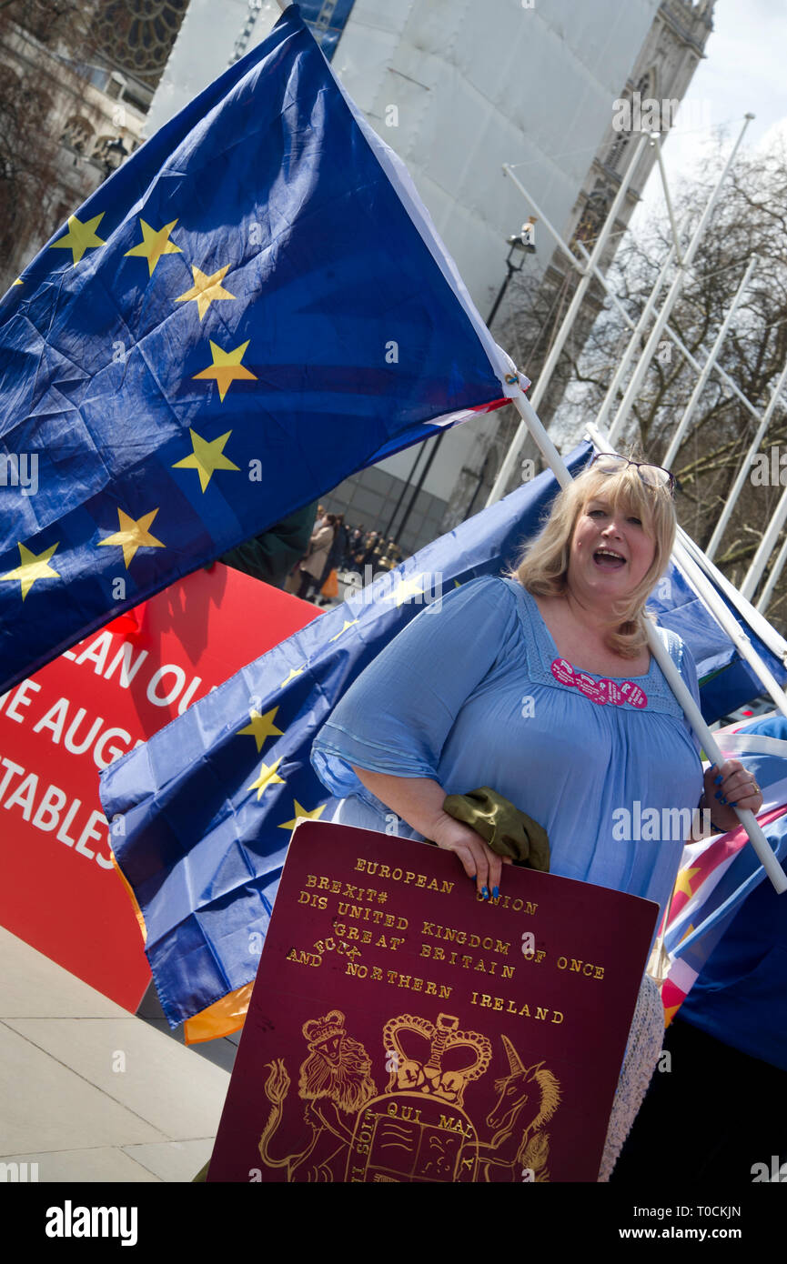 Westminster March 18th 2019. Remain protester Jane outside Parliament with large passport. Stock Photo