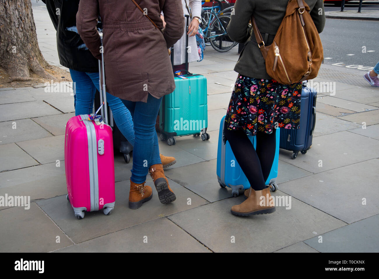Westminster March 18th 2019. Tourists with clouful suitcases. Stock Photo