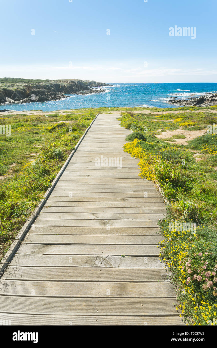 Wooden footbridge to the sardinian coast at coscia di donna Stock Photo