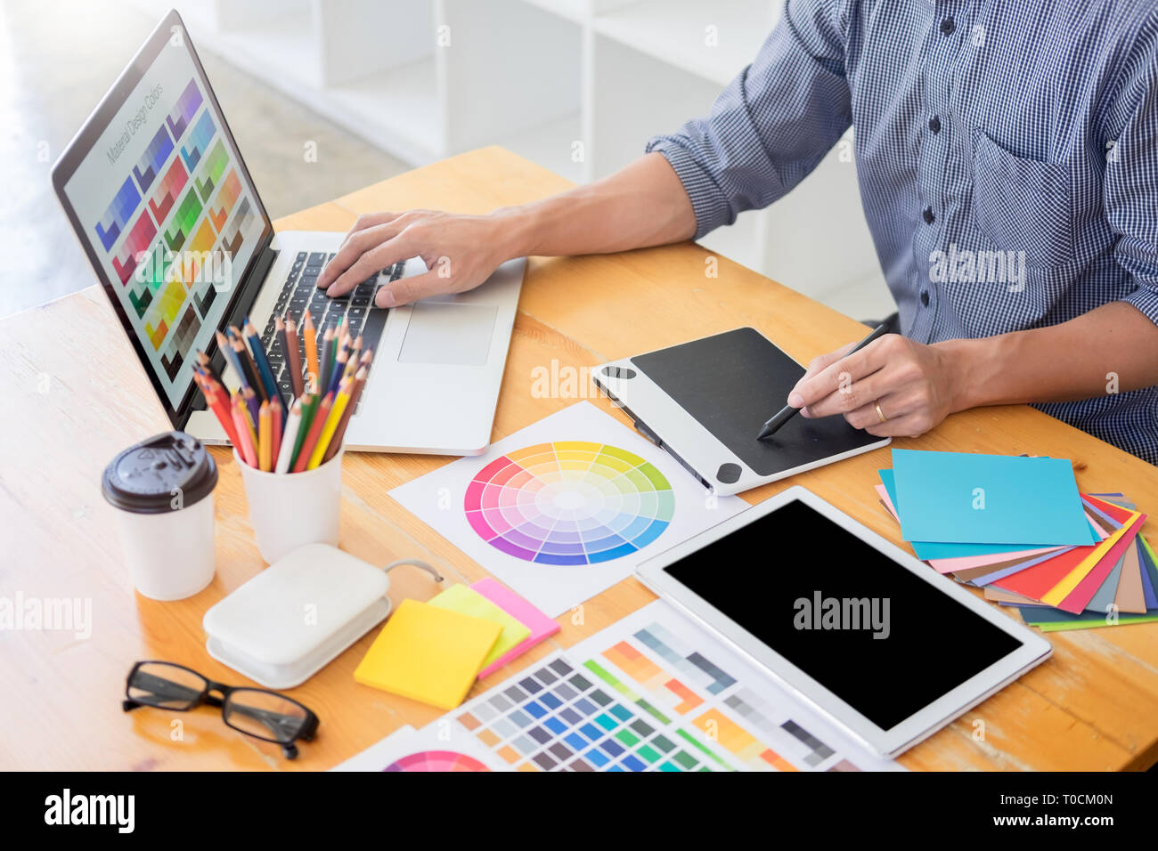 team Web designer working drawing something on graphic computer in the office or studio Stock Photo