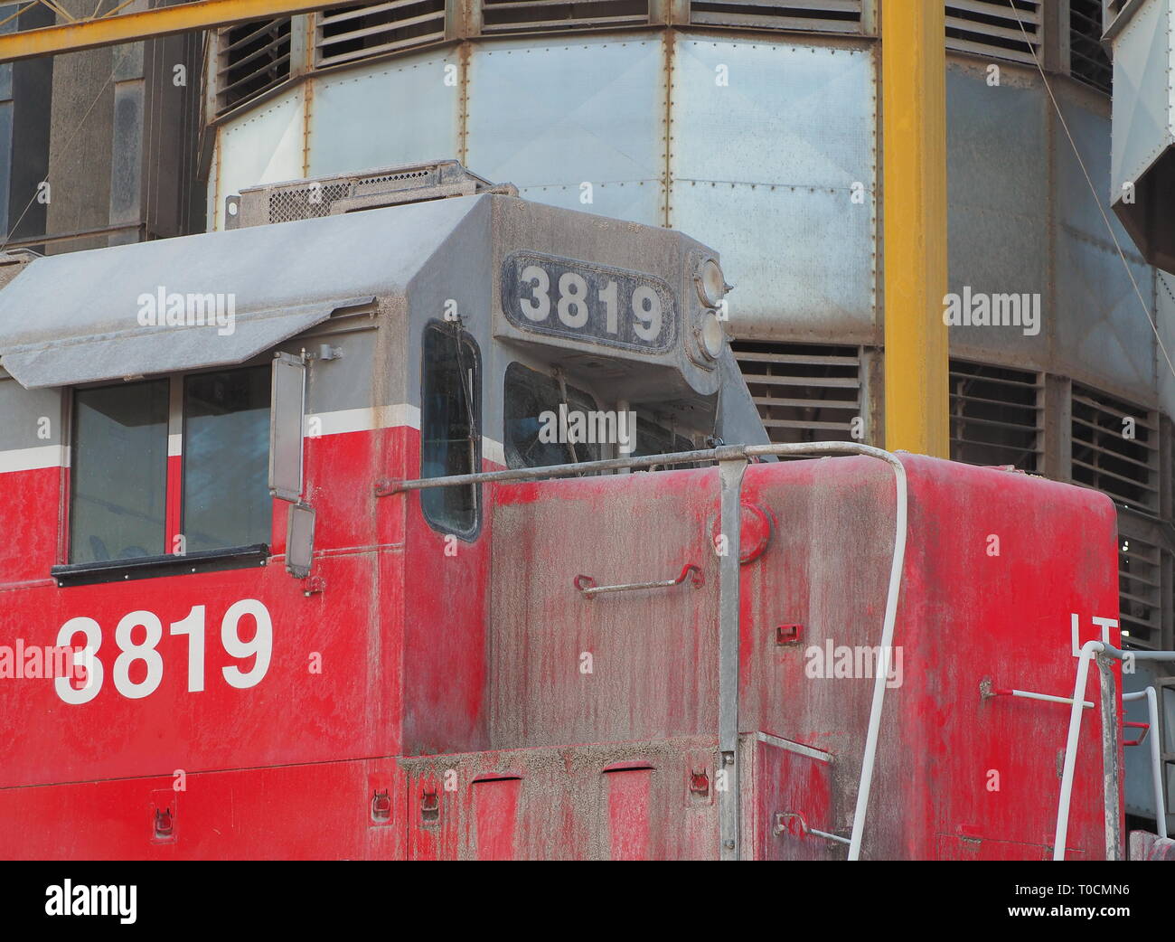 Red train locomotive close up at a grain silo Stock Photo