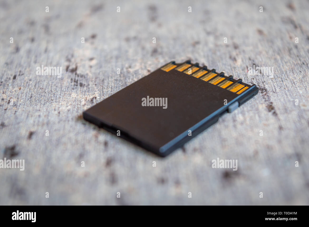 Close up of a memory card placed on a grey table Stock Photo
