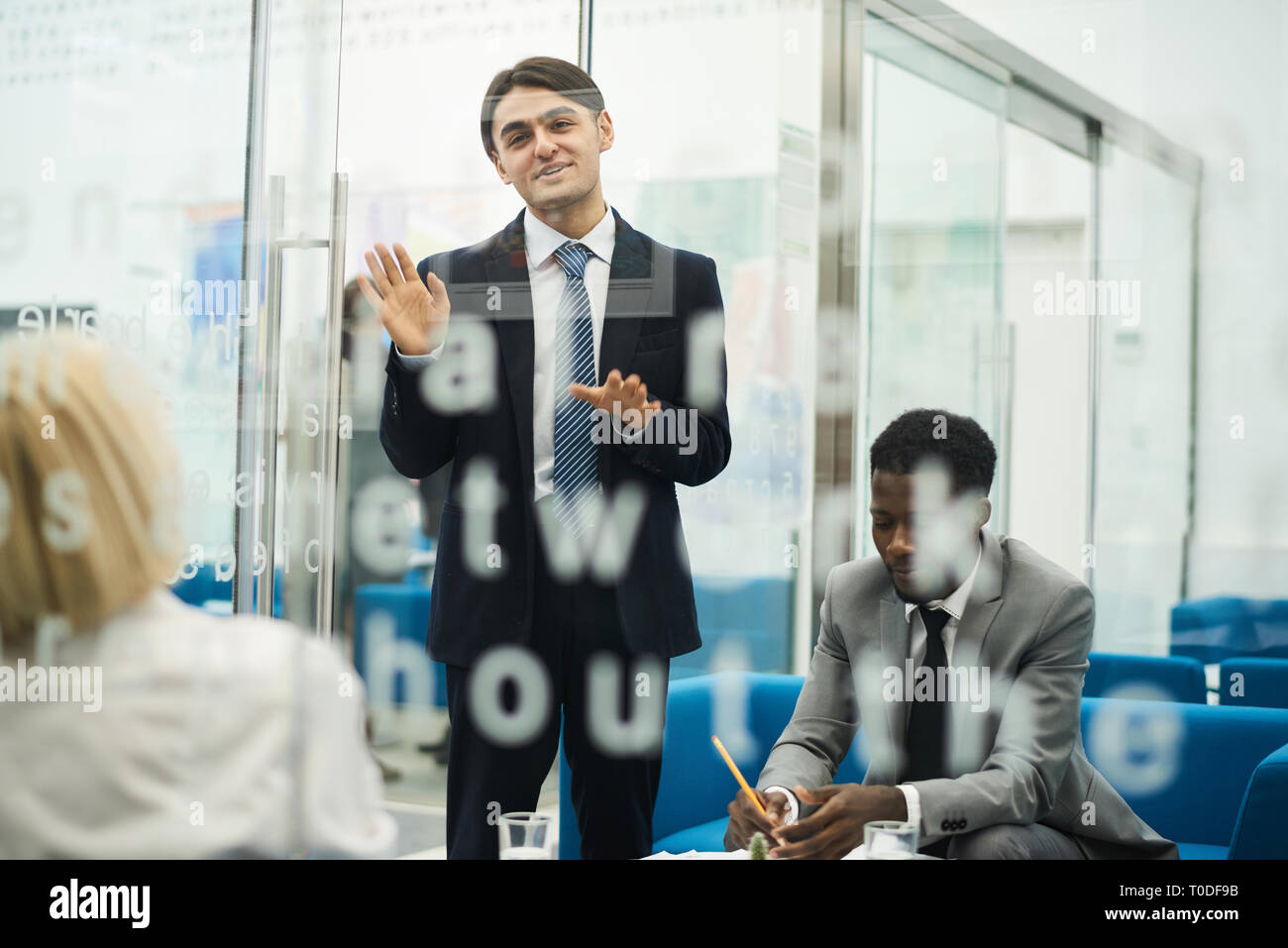 Young Businessman Giving Presentation Stock Photo
