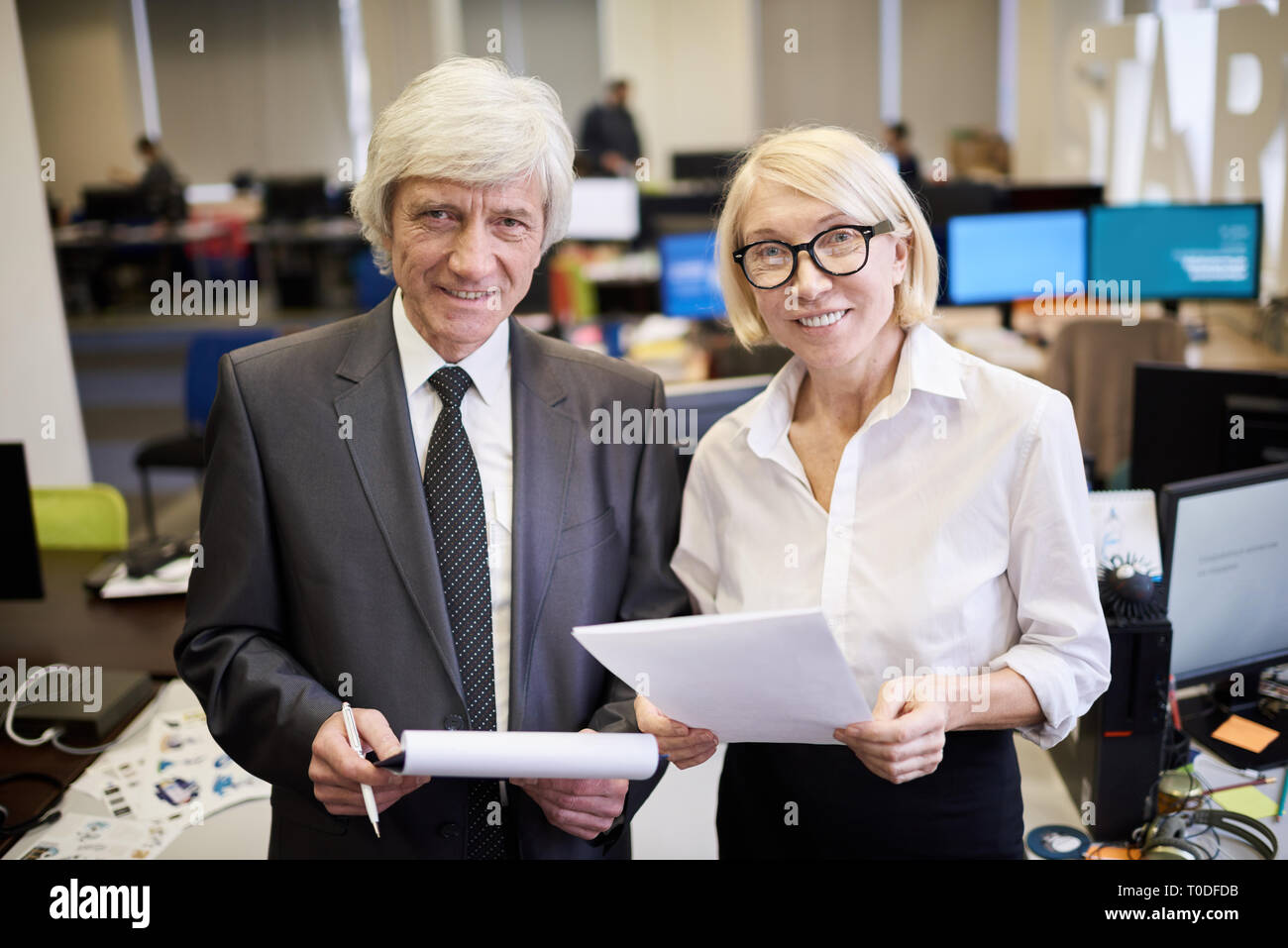 Two Mature Executives Posing in Office Stock Photo