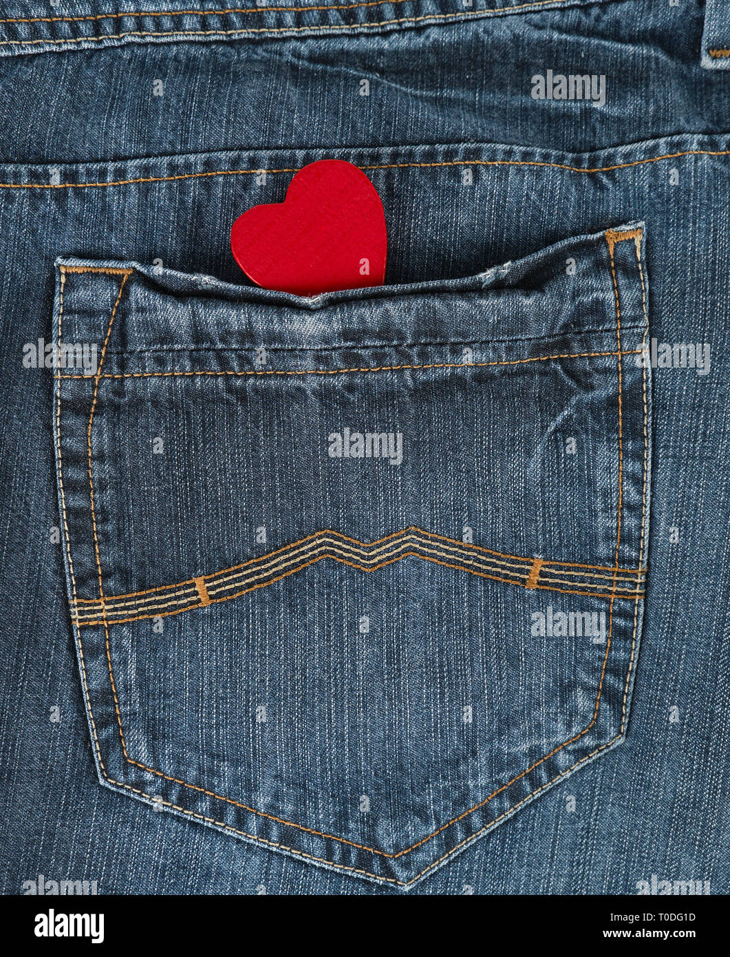 small red heart in the back pocket of blue jeans, full frame Stock ...