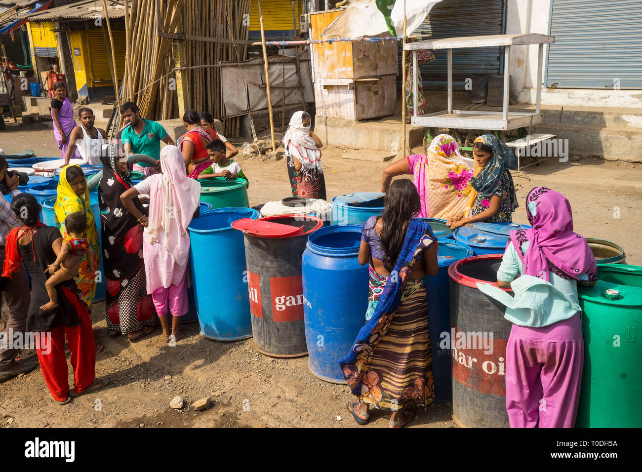 People filling water in plastic drums from water tanker, Bhiwandi