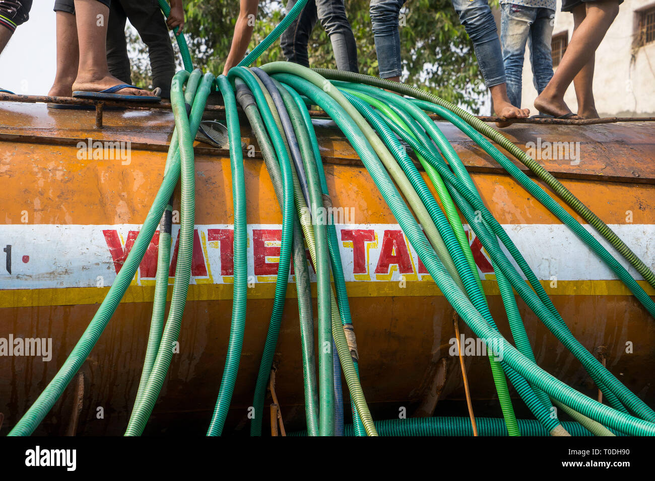 Pipes to fill water from water tanker, Bhiwandi, Thane, Maharashtra