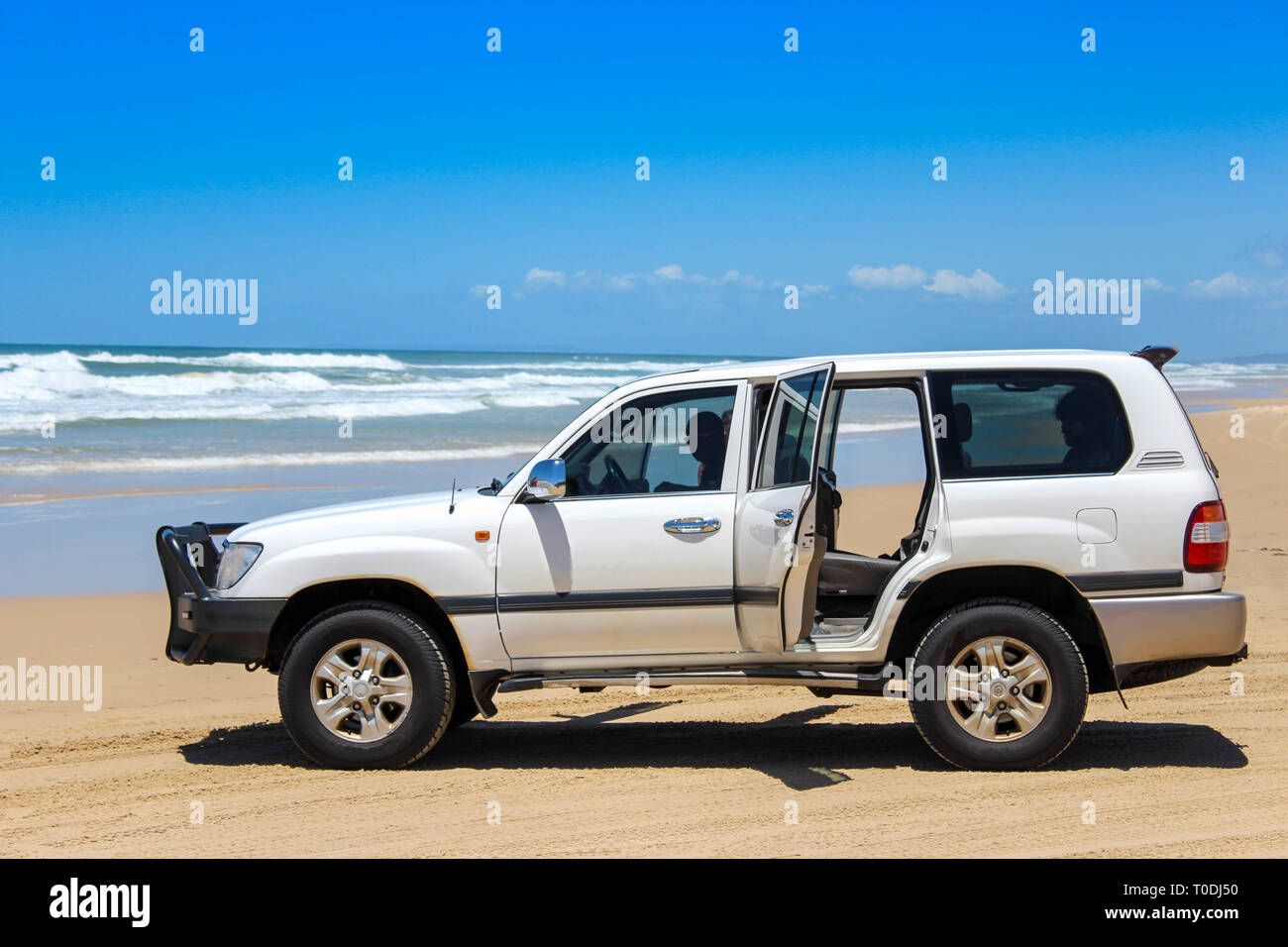 car on beach road highway in fraser island, travel adventure australia Stock Photo