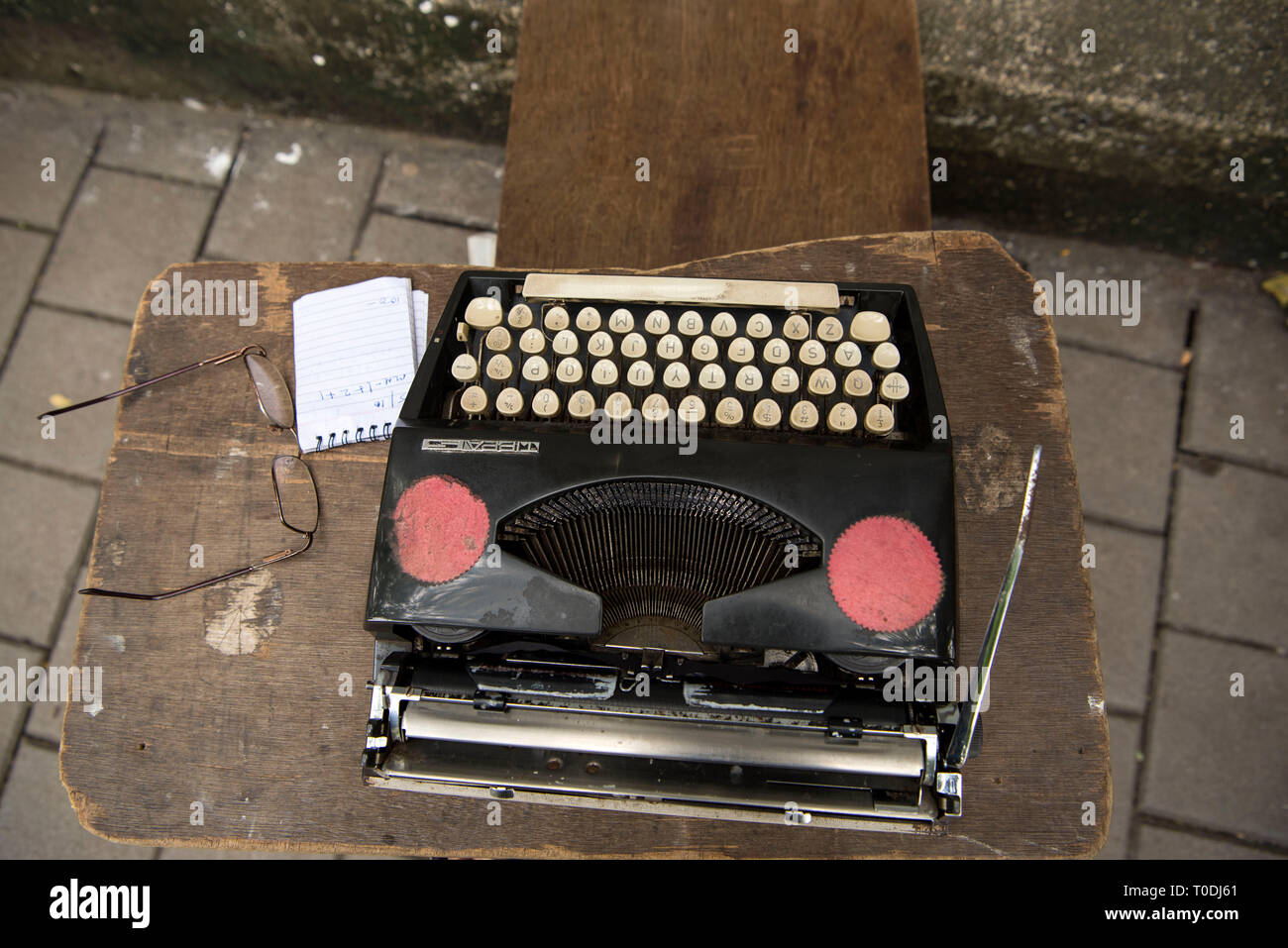 typewriter on Pavement Mumbai, Maharashtra, India, Asia Stock Photo