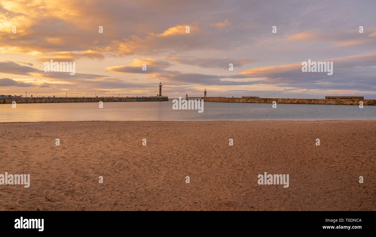 Whitby, North Yorkshire, England, UK - September 13, 2018: View towards East Pier and West Pier from the Tate Hill Pier Stock Photo