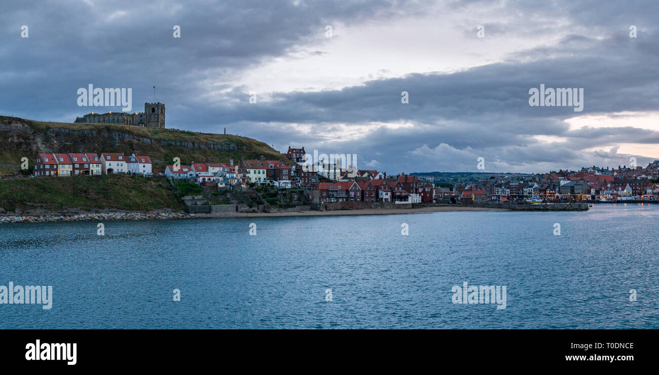 Whitby, North Yorkshire, England, UK -September 13, 2018: Evening view towards the city from the Pier Road Stock Photo