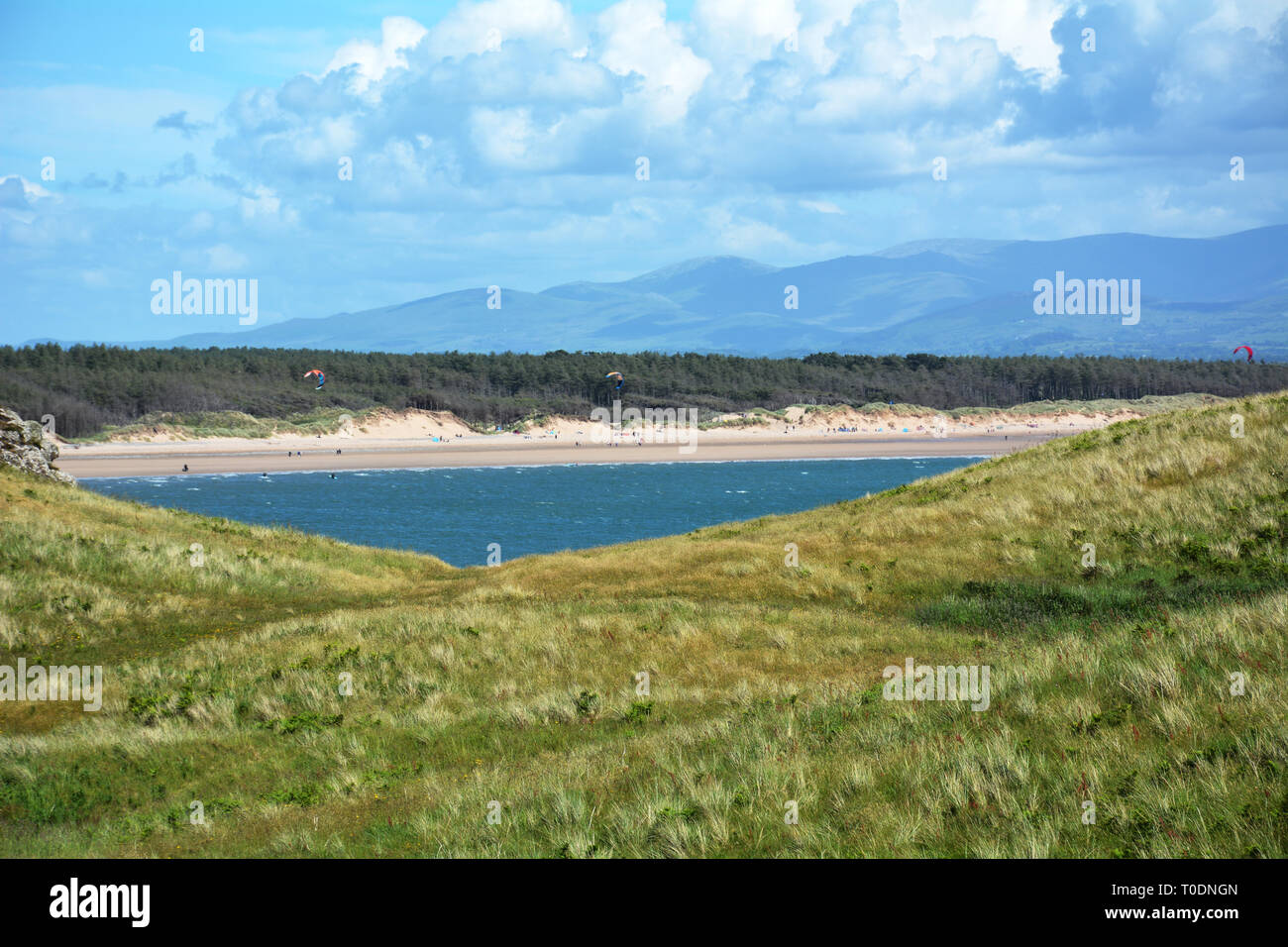 Looking across to Newborough forest and beach on Anglesey from the equally beautiful Llanddwyn Island in North Wales Stock Photo