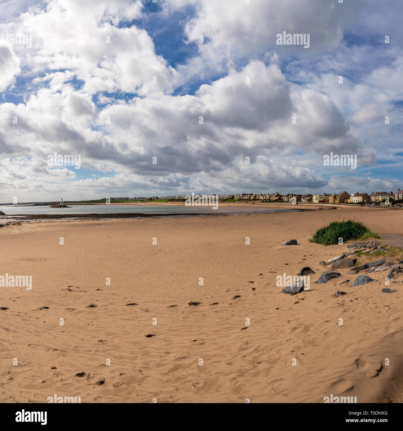 Newbiggin-by-the-Sea, Northumberland, England, UK - September 11, 2018: View at the beach with The Couple (statue) and breakwater Stock Photo