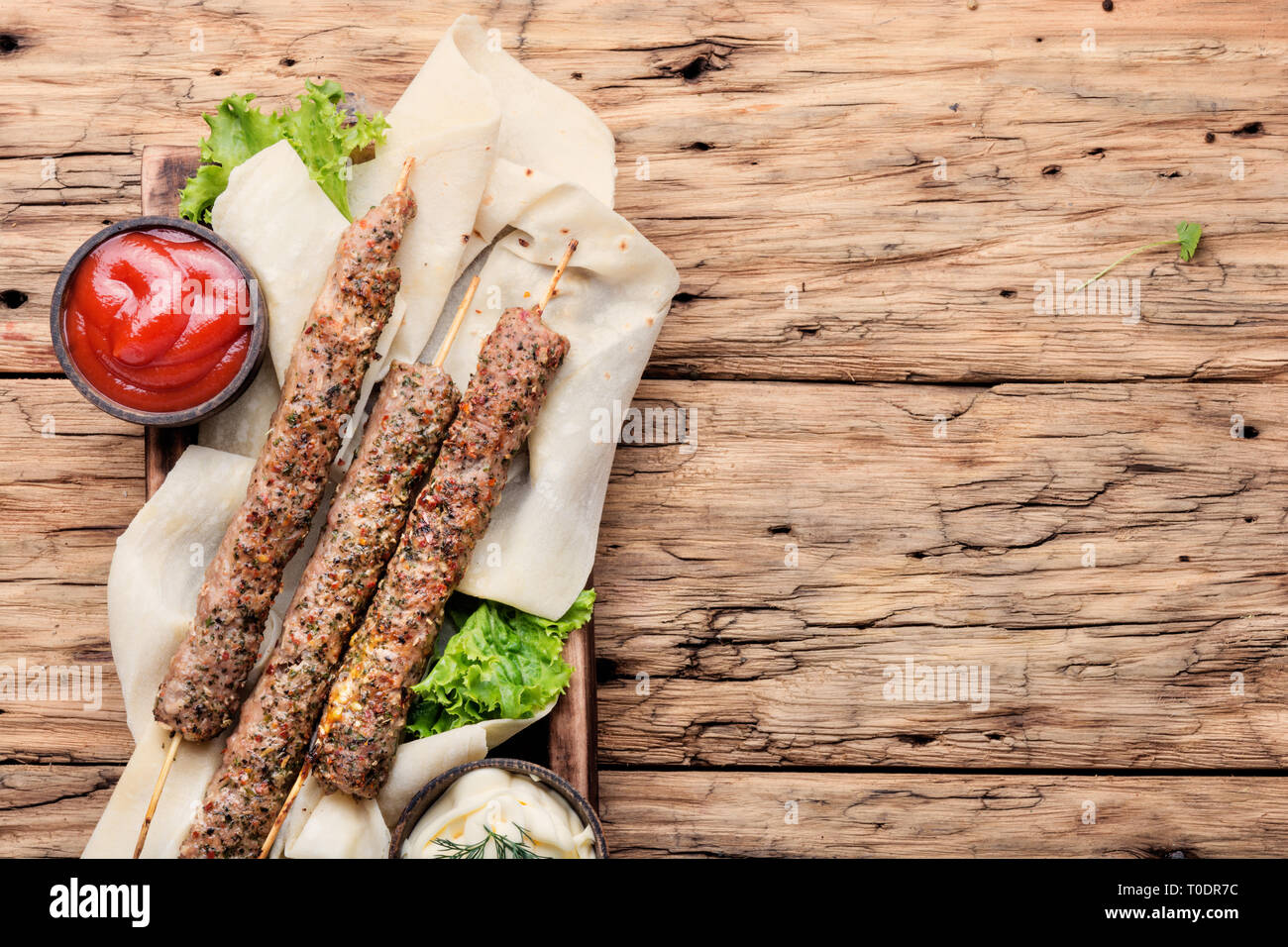Grilled Lula kebab lamb with sauce.Traditional oriental cuisine Stock Photo Alamy