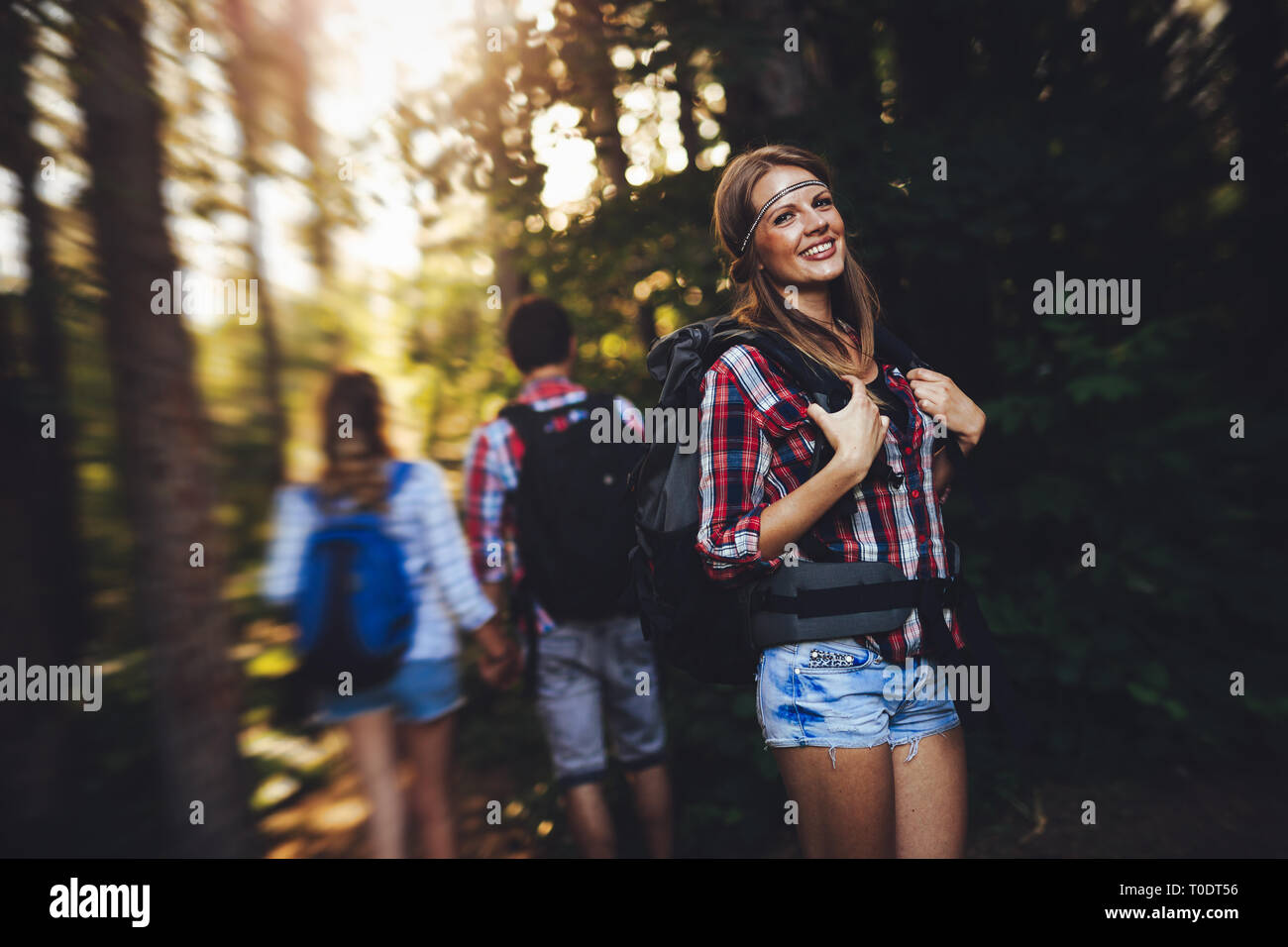 Group of backpacking hikers going for forest trekking Stock Photo Alamy