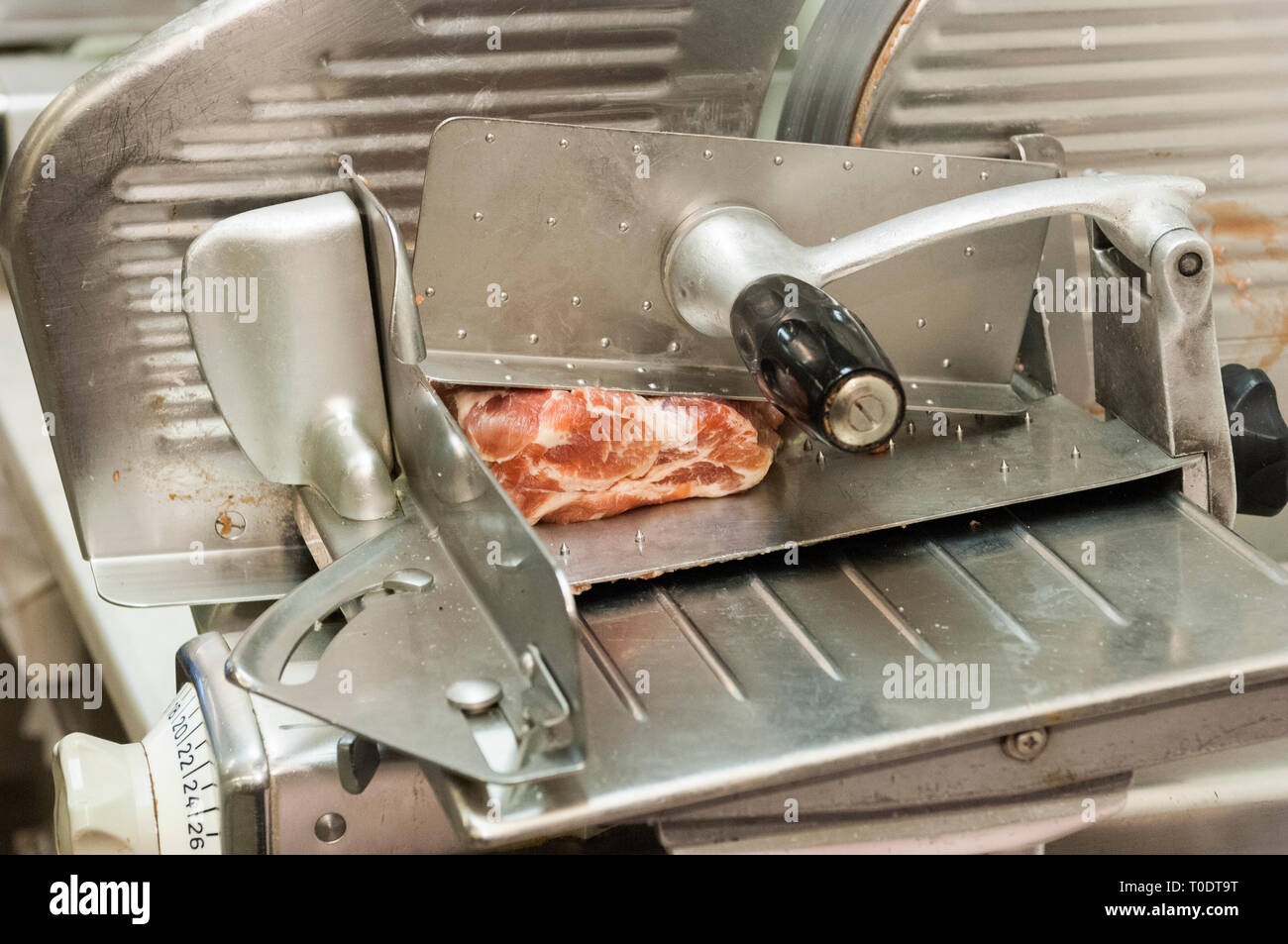 Cutting machine with meat piece, Sweden. Stock Photo