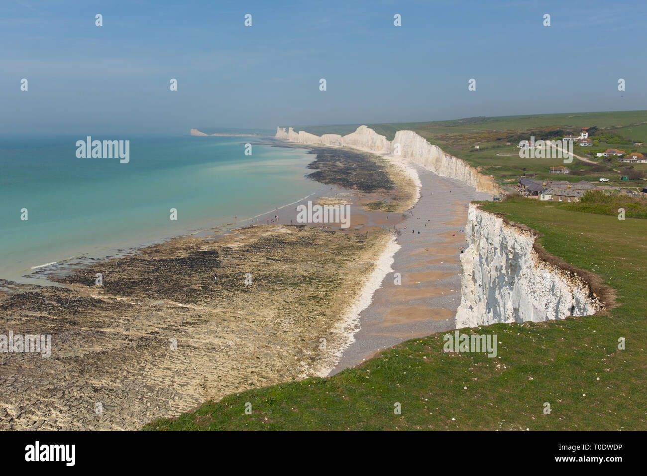 Birling gap beach and Seven Sisters white cliffs East Sussex England UK beautiful British coast with tide out Stock Photo