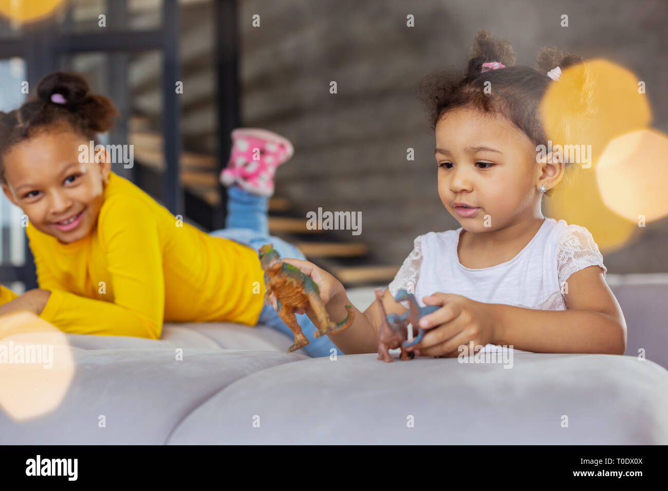 Cute girls spending weekend at home together Stock Photo