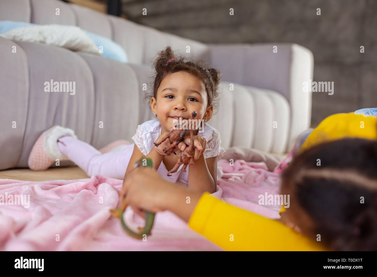 Amazing dark-skinned child looking straight at camera Stock Photo