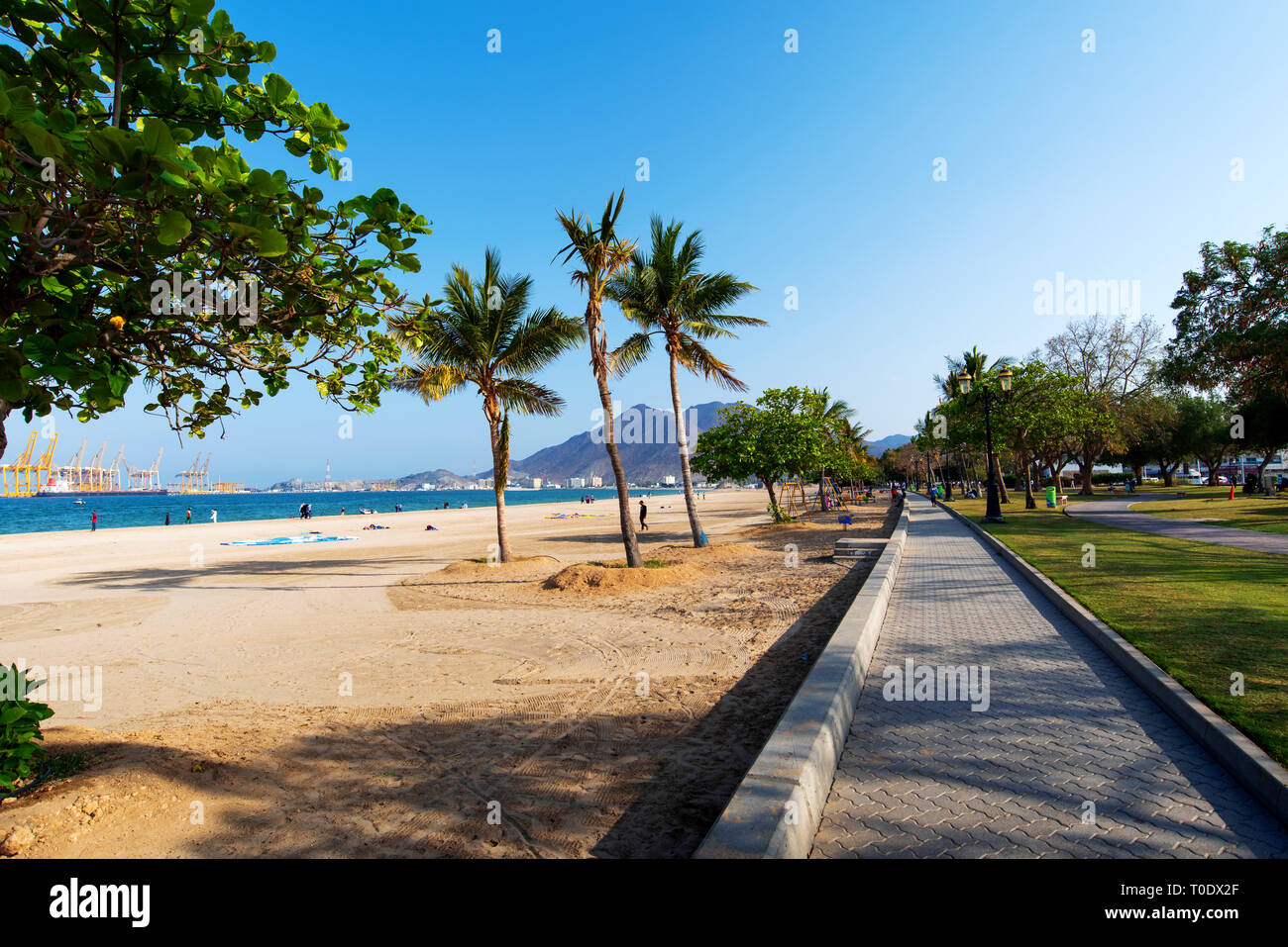 Khor Fakkan, United Arab Emirates - March 16, 2019: Khor Fakkan public beach in the emirate of Sharjah in United Arab Emirates on a sunny day Stock Photo