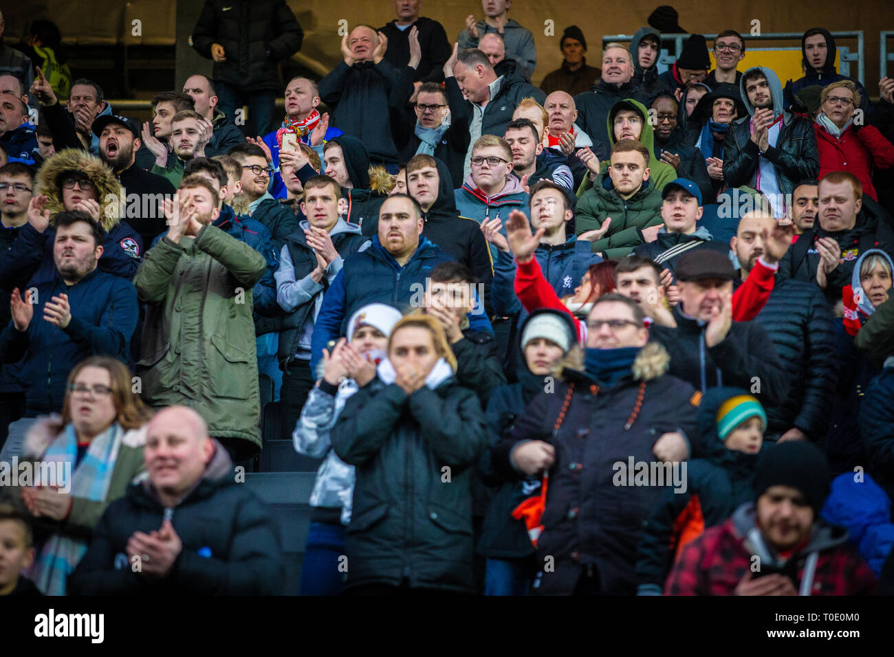 Football fans of English club watching match. Stock Photo