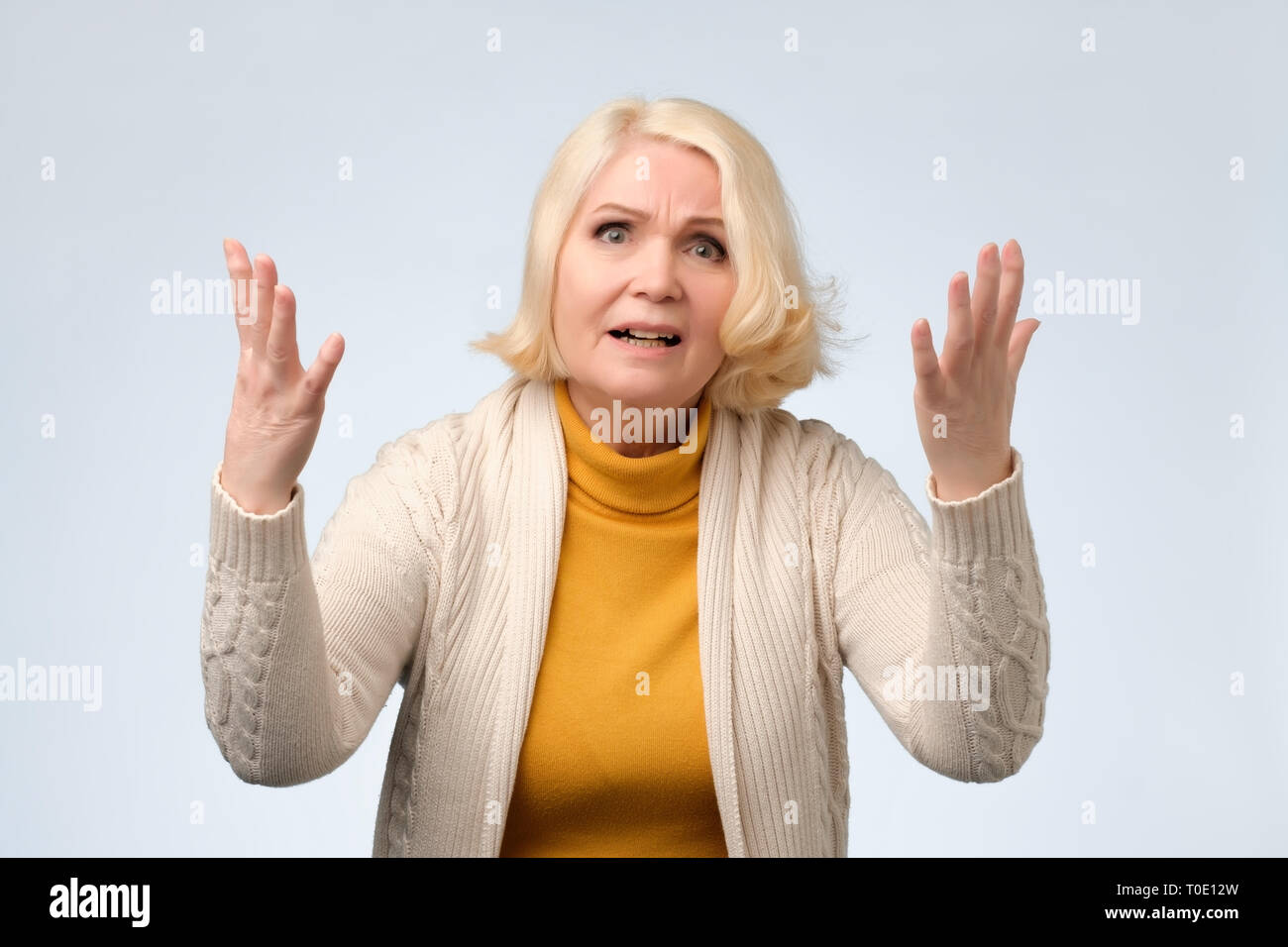 Angry old woman arguing with her husband Stock Photo