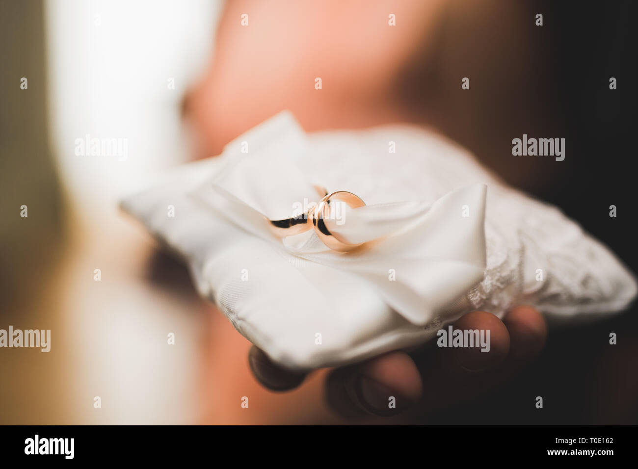 Wedding rings on ceremony at church. Macro. Stock Photo