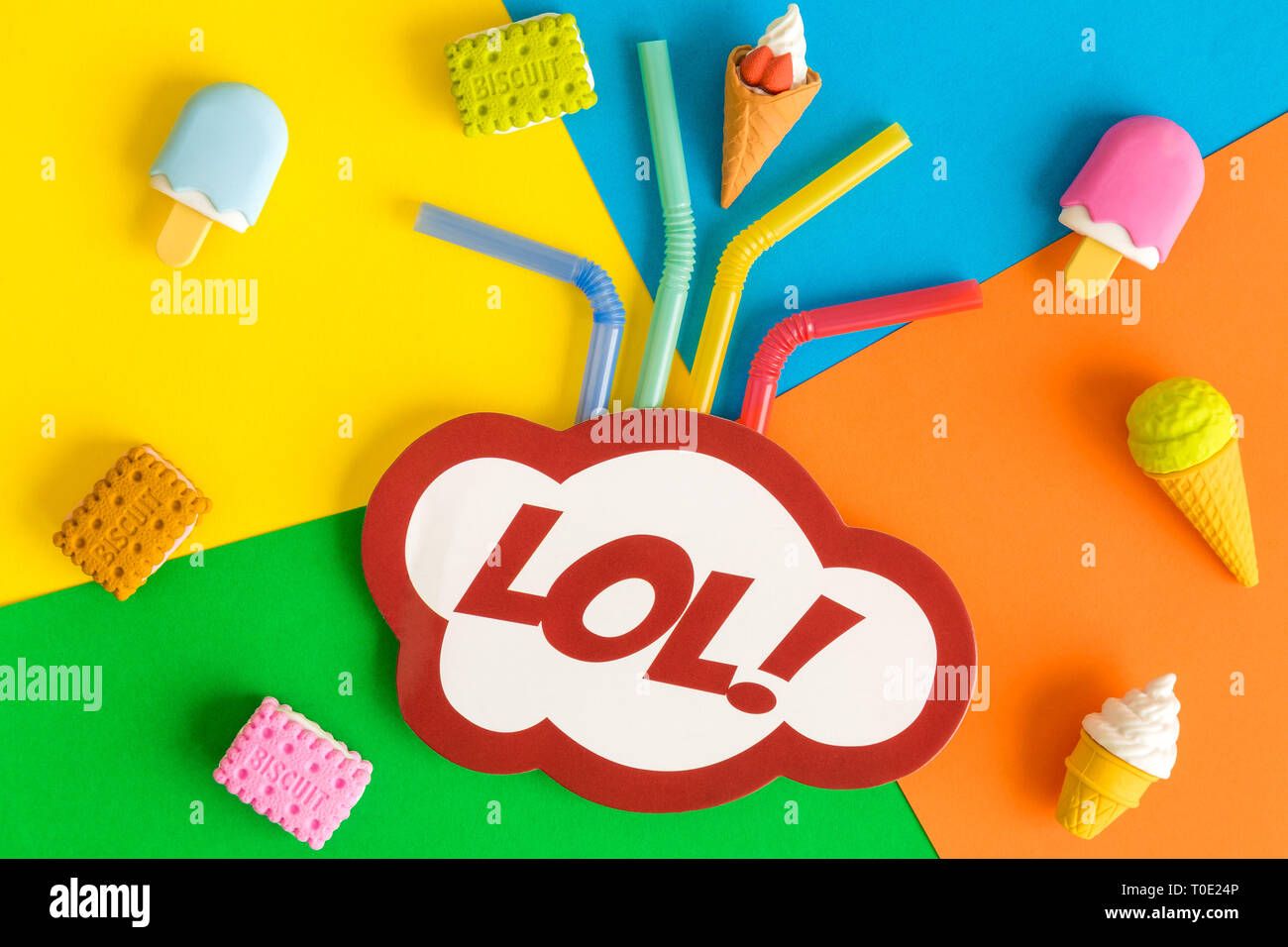 Lol in pop art style with drinking straws, ice cream and biscuits