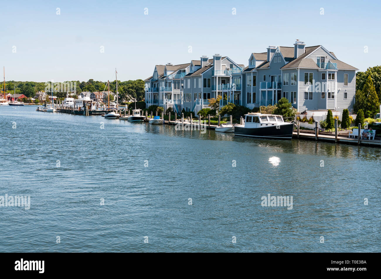 View of the Mystic Seaport with boats and houses, Connecticut Stock Photo