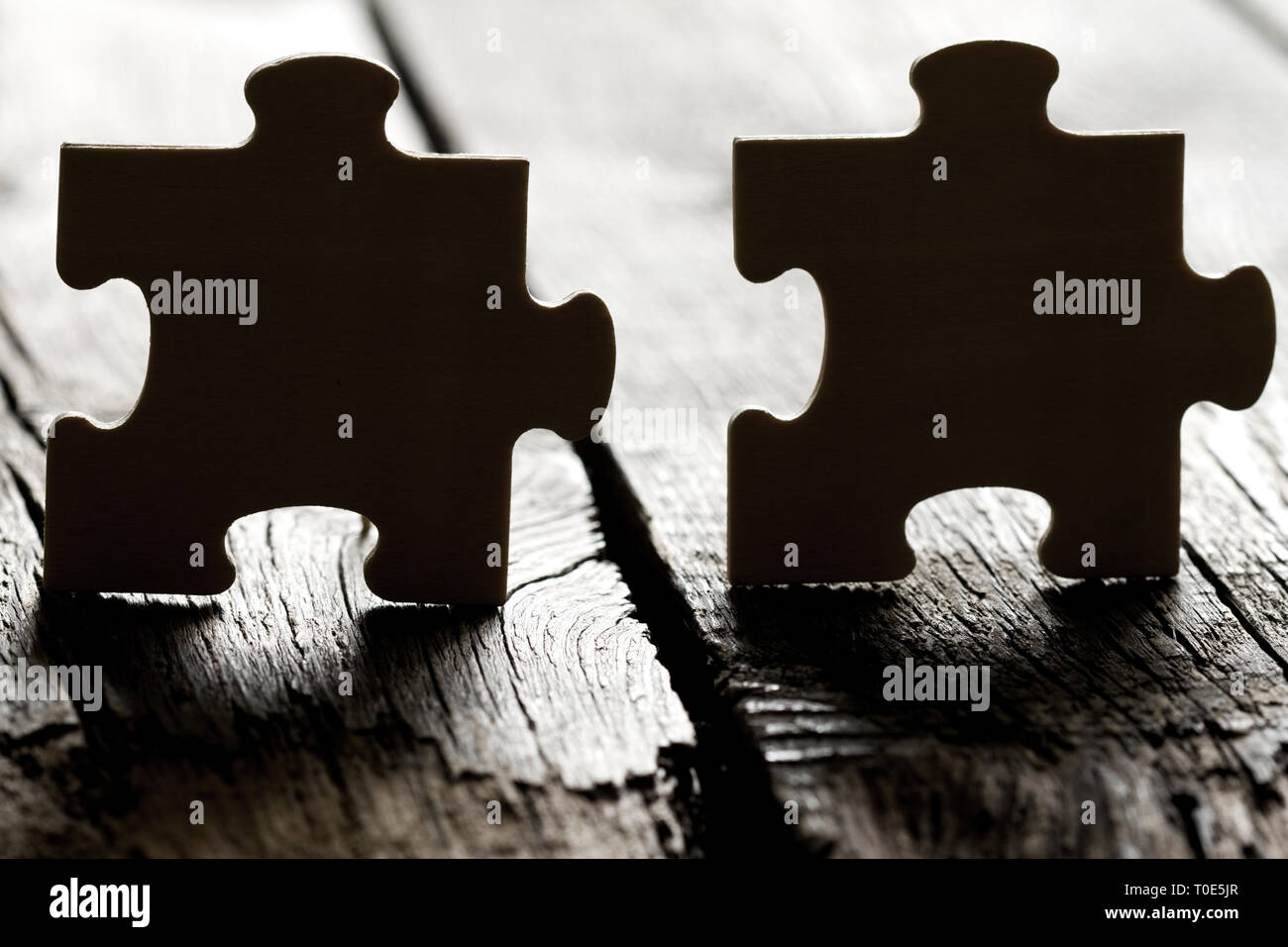 Help in business and teamwork concept with puzzle on the edge Stock Photo