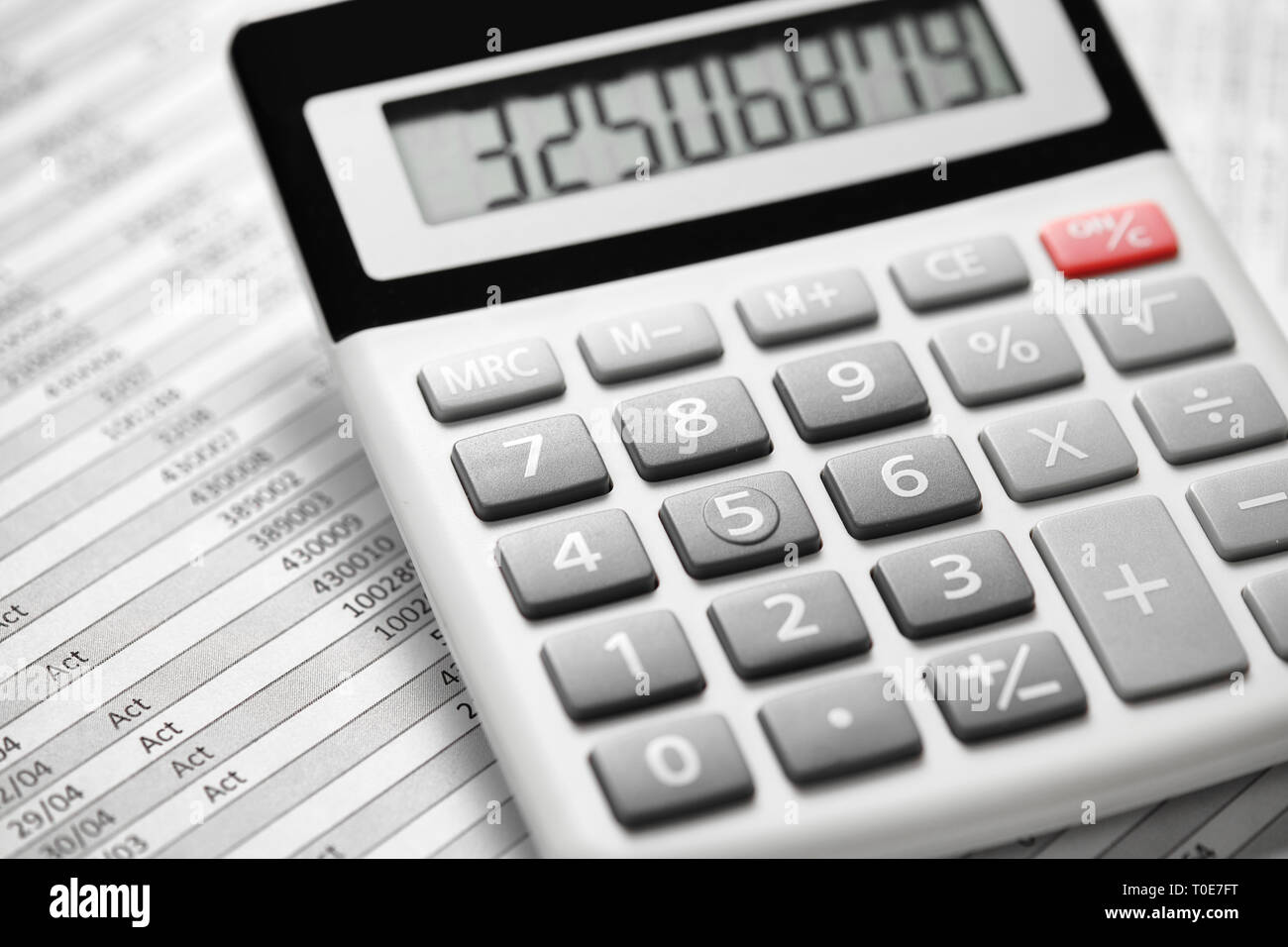 Calculator and reports closeup. Office supplies for working and calculating finance. Business financial accounting concept. Stock Photo