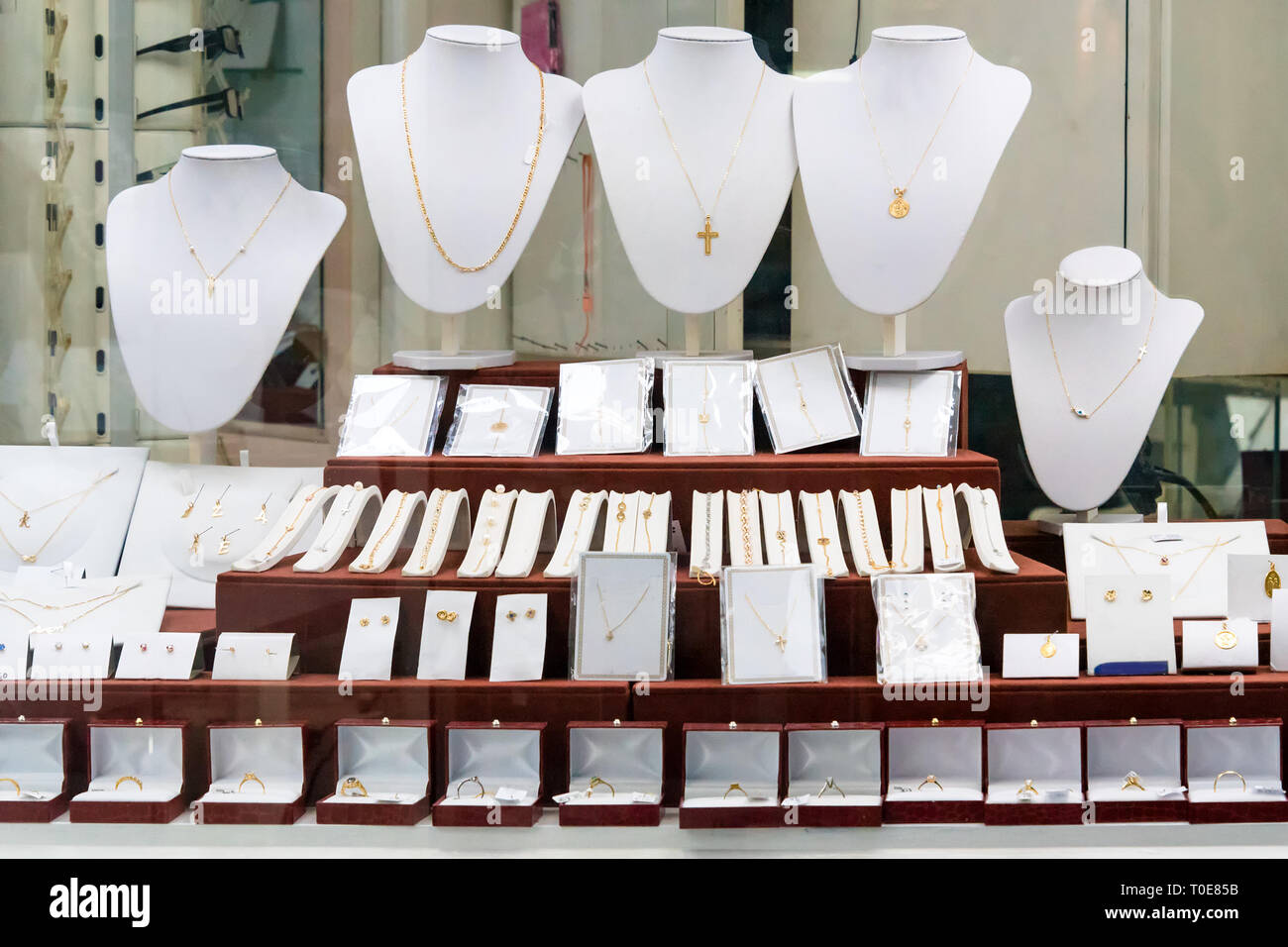 Jewelry diamond rings and necklaces show in luxury retail store window