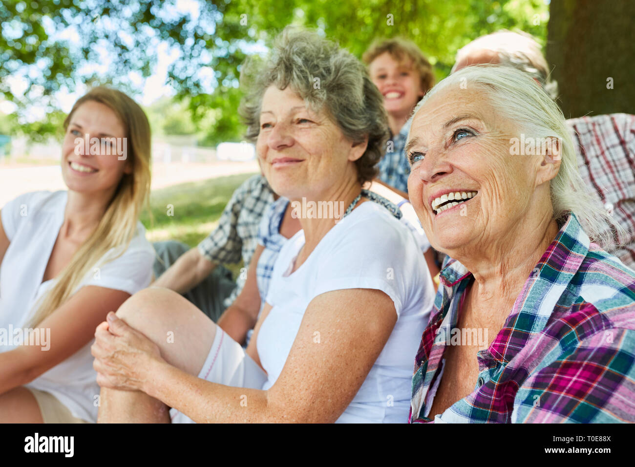 Happy extended family with grandparents and grandson together in the ...