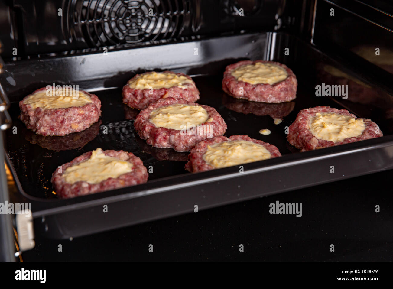 Fresh hot veal cutlet in fillo dough in the open ovenProcess of home