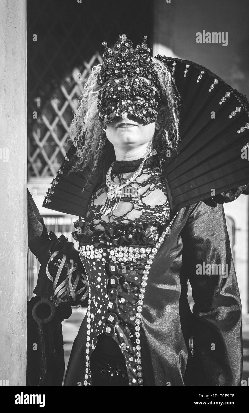 Masked woman during venetian carnival in a b/W image Stock Photo