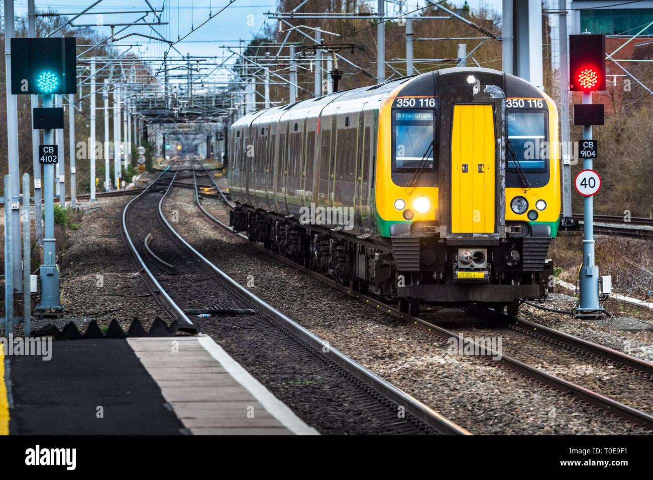 LNWR London Northwestern Railway train passing through Hampton-in-Arden station near Birmingham UK Stock Photo