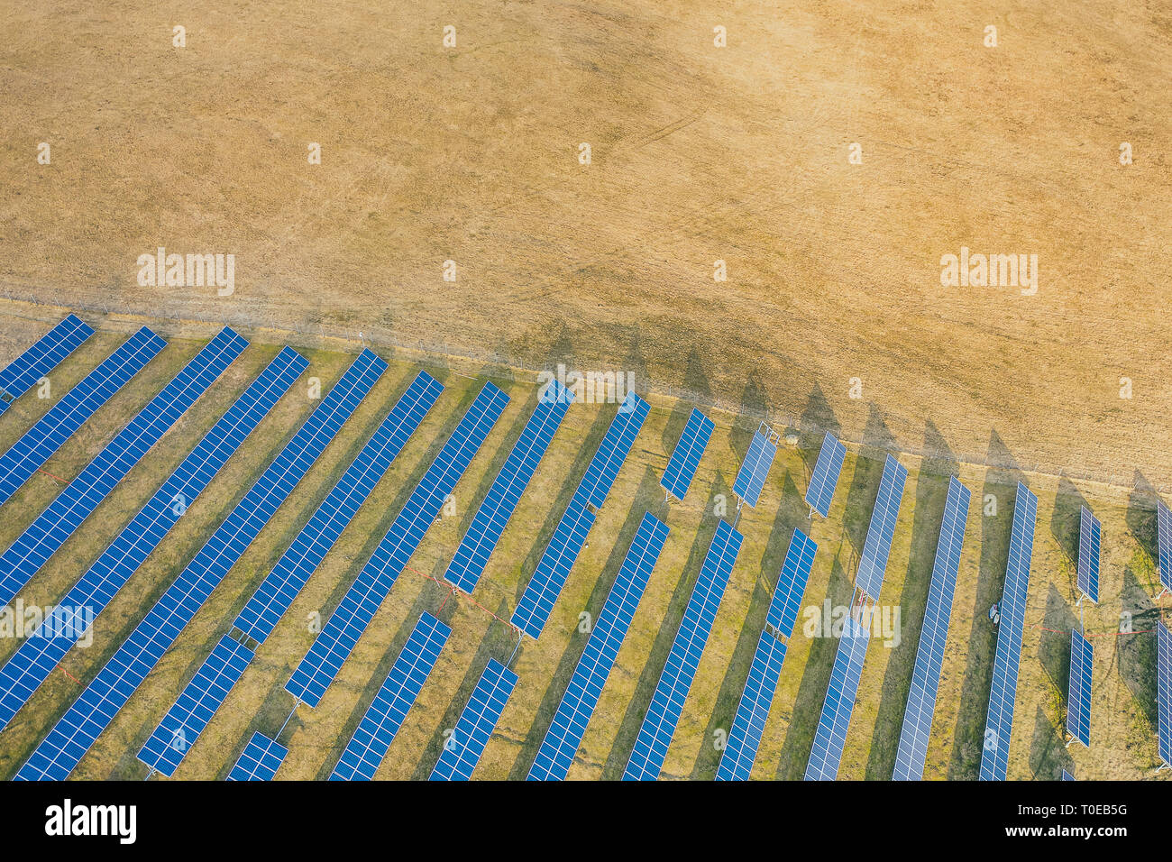 Aerial drone view of solar panels at a solar energy farm. Vilnius county, Lithuania Stock Photo