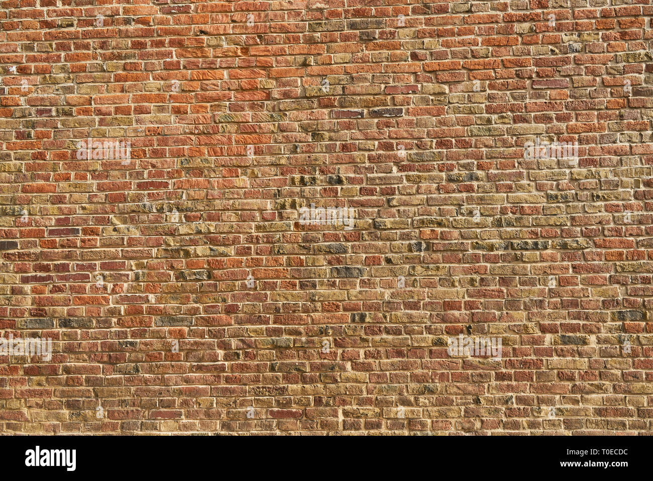 Old wall from many red bricks as background texture Stock Photo